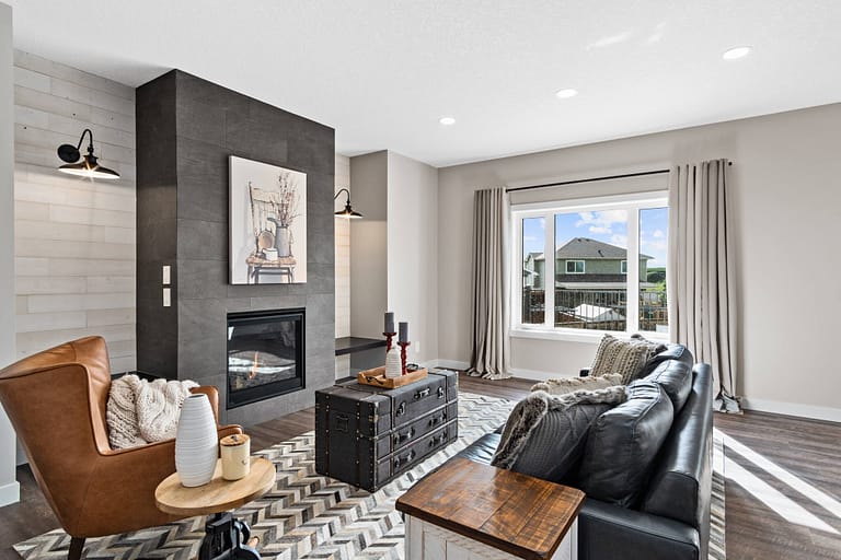 Fully staged living room with fireplace